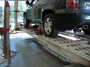 Car being repaired on our frame machine